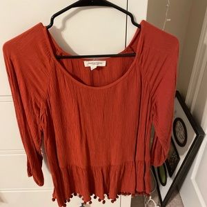 Loose fitting burnt orange blouse